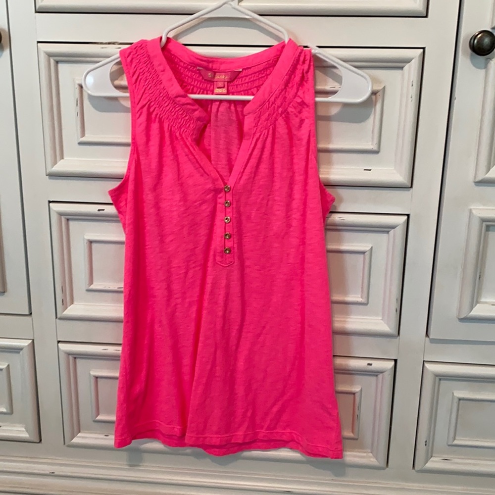 Lilly Pulitzer got pink shirt.